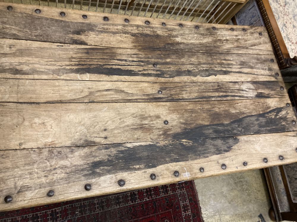 An Indonesian studded hardwood rectangular coffee table, width 180cm depth 98cm height 48cm